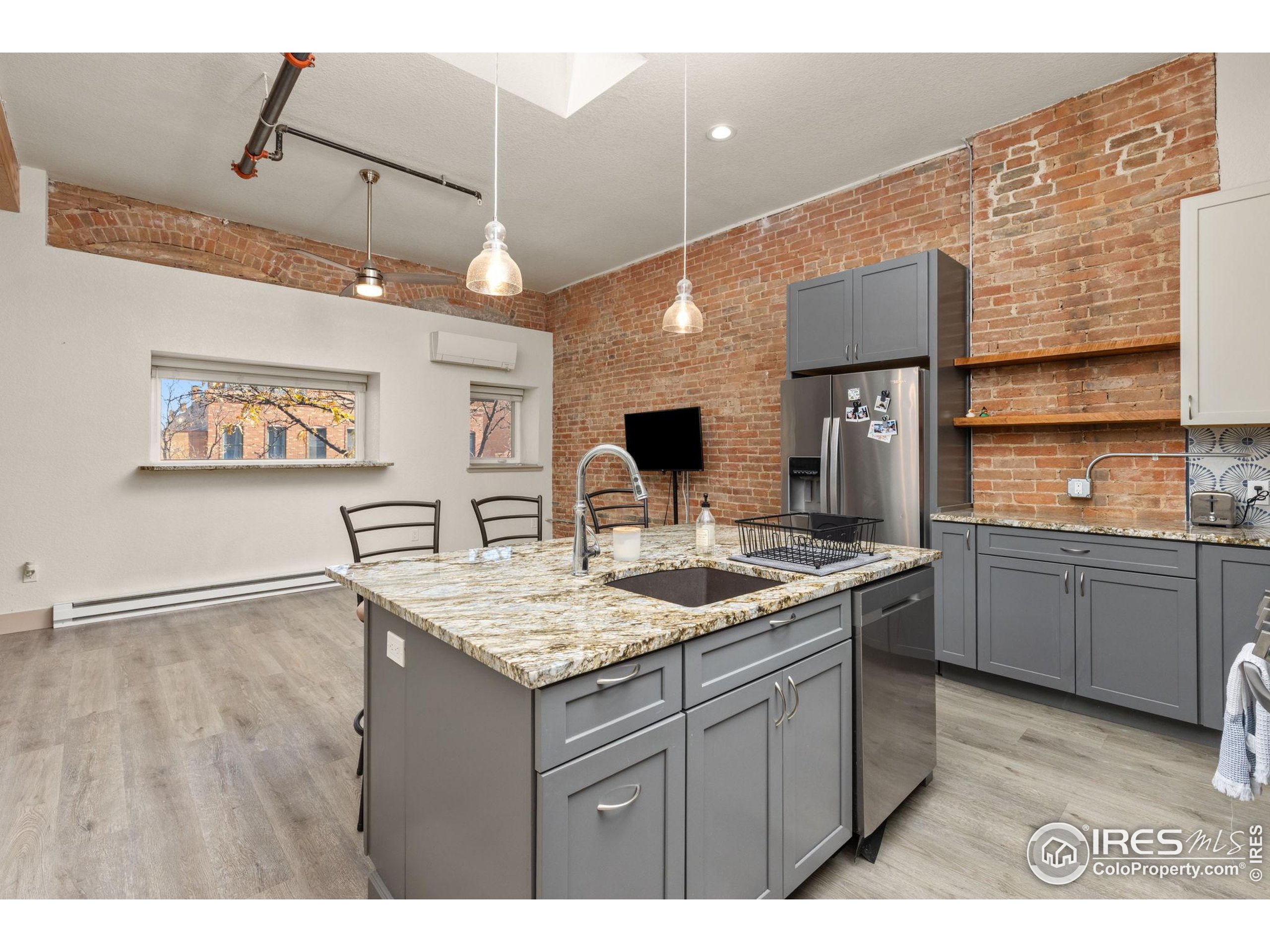 331 Main Street Longmont, CO 80501 - Photo 25 of 50 a kitchen with a sink a counter space and appliances