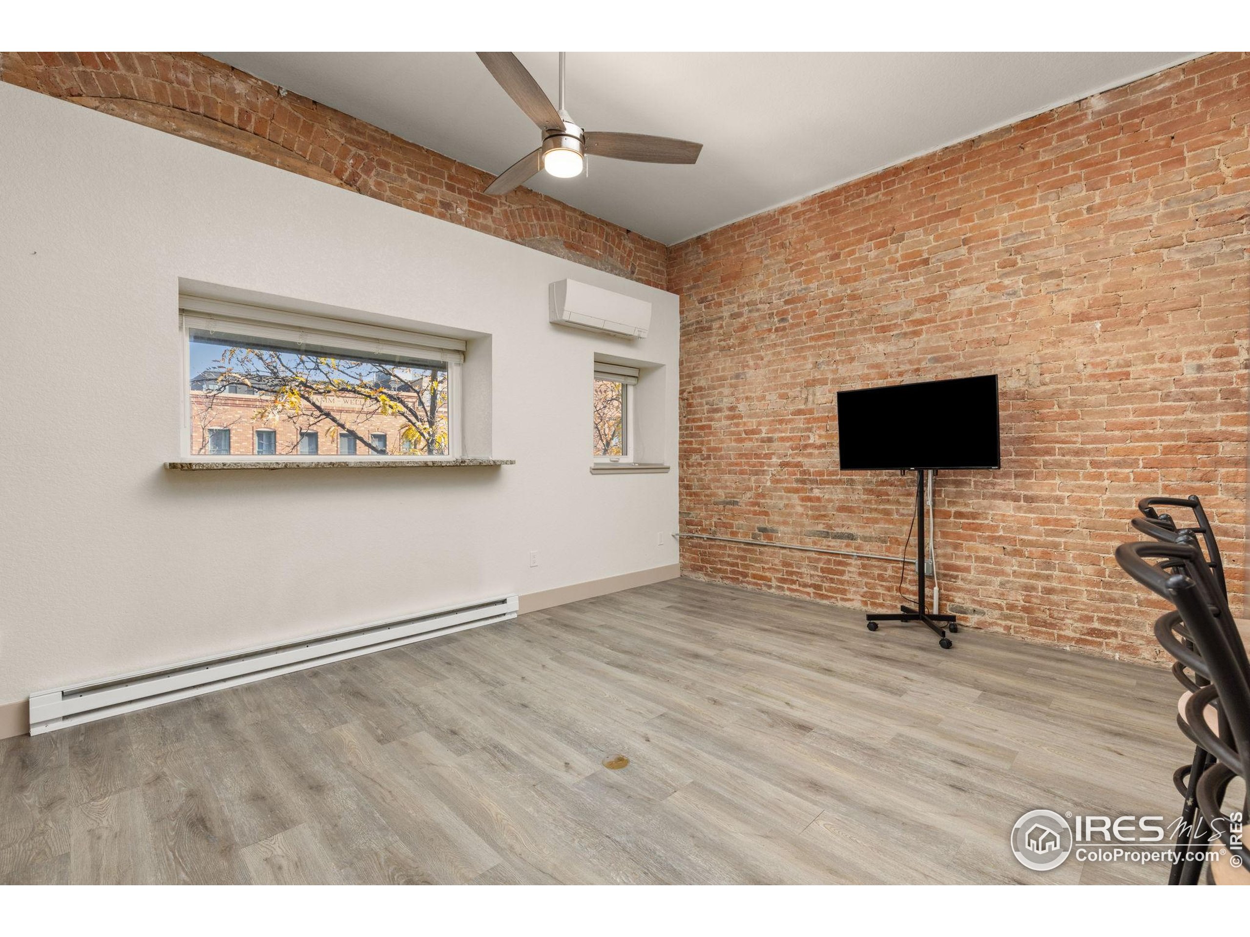 331 Main Street Longmont, CO 80501 - Photo 29 of 50 a view of an empty room with wooden floor