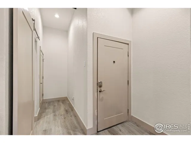 a kitchen with kitchen island granite countertop a stove top oven a sink a counter space and cabinets