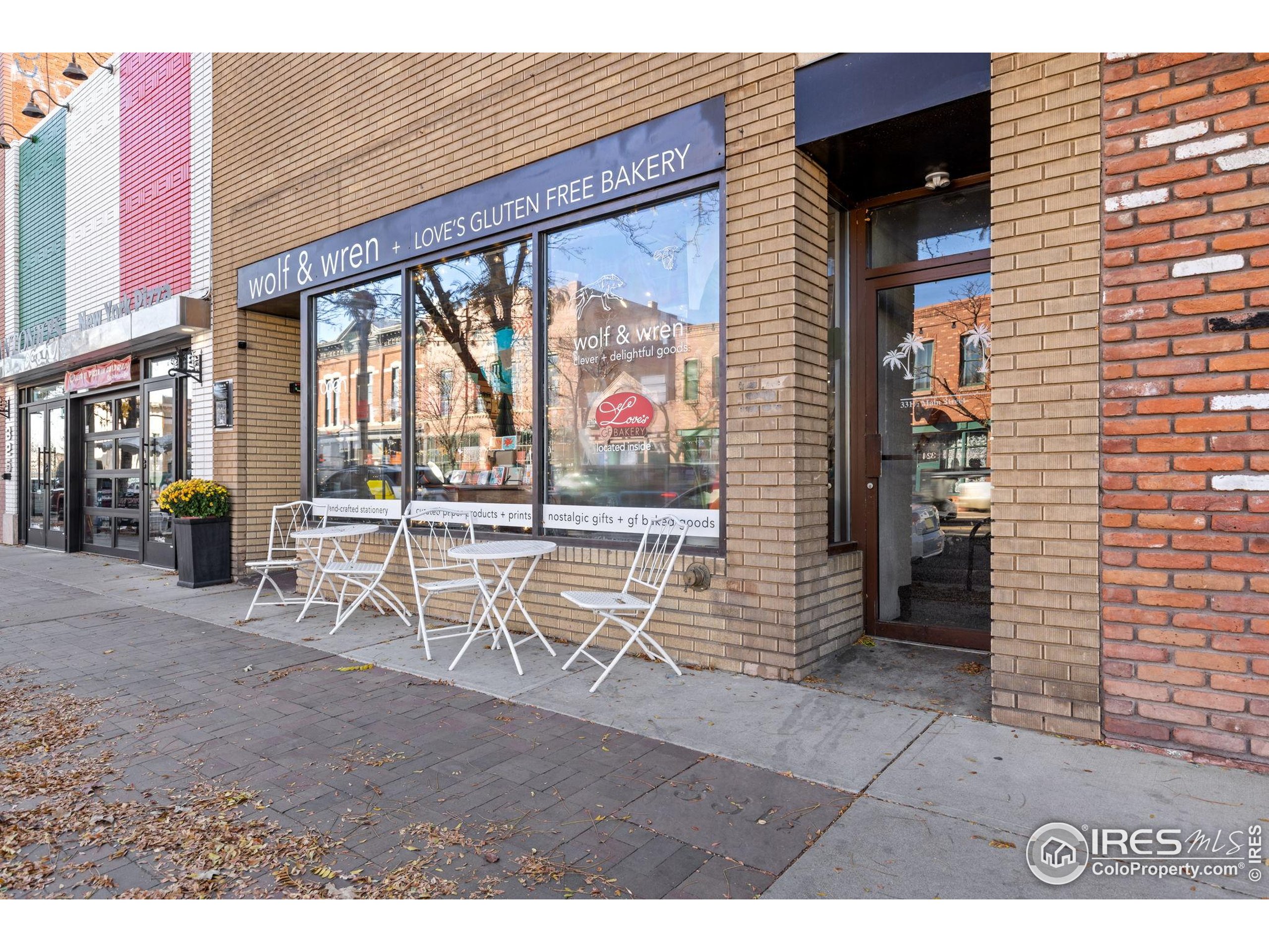 331 Main Street Longmont, CO 80501 - Photo 3 of 50 a dining room with furniture and a floor to ceiling window