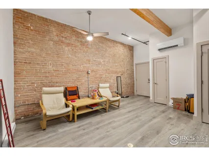a kitchen with a dining table chairs refrigerator and cabinets