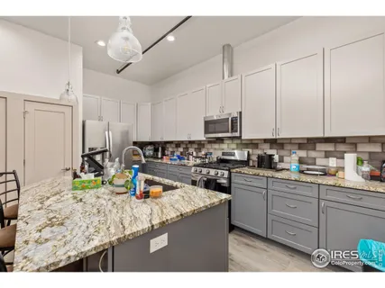 a view of a livingroom with wooden floor