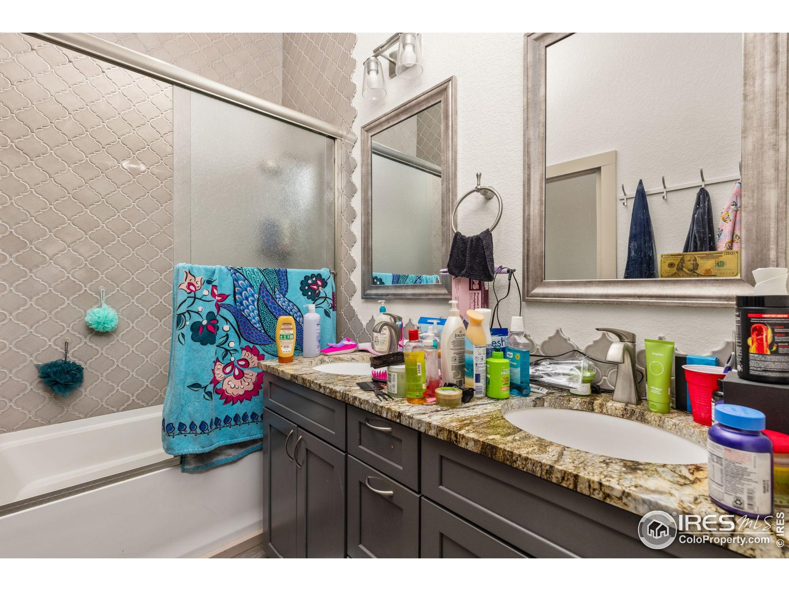 331 Main Street Longmont, CO 80501 - Photo 43 of 50 a bathroom with a sink mirror and vanity