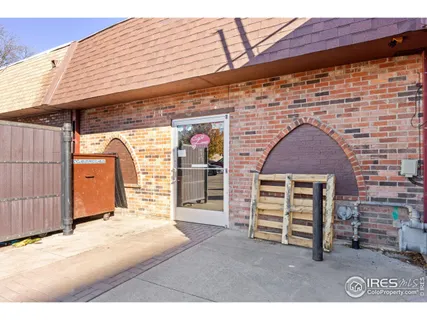 a view of a terrace with furniture and stove