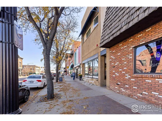 a backyard of a house with cars parked