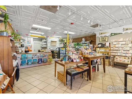 a living room with lots of furniture and white walls