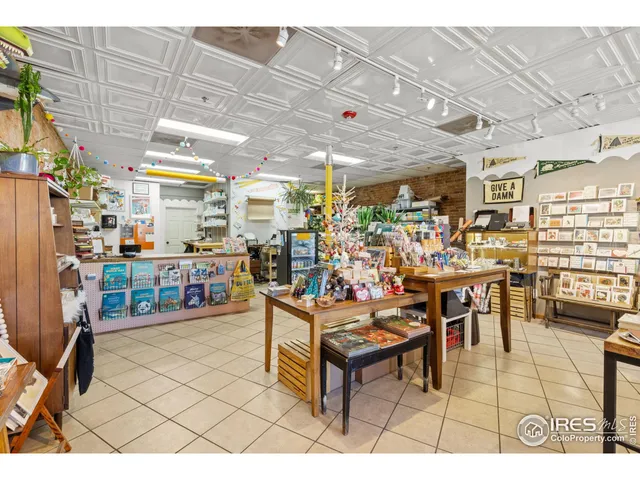 a living room with lots of furniture and white walls