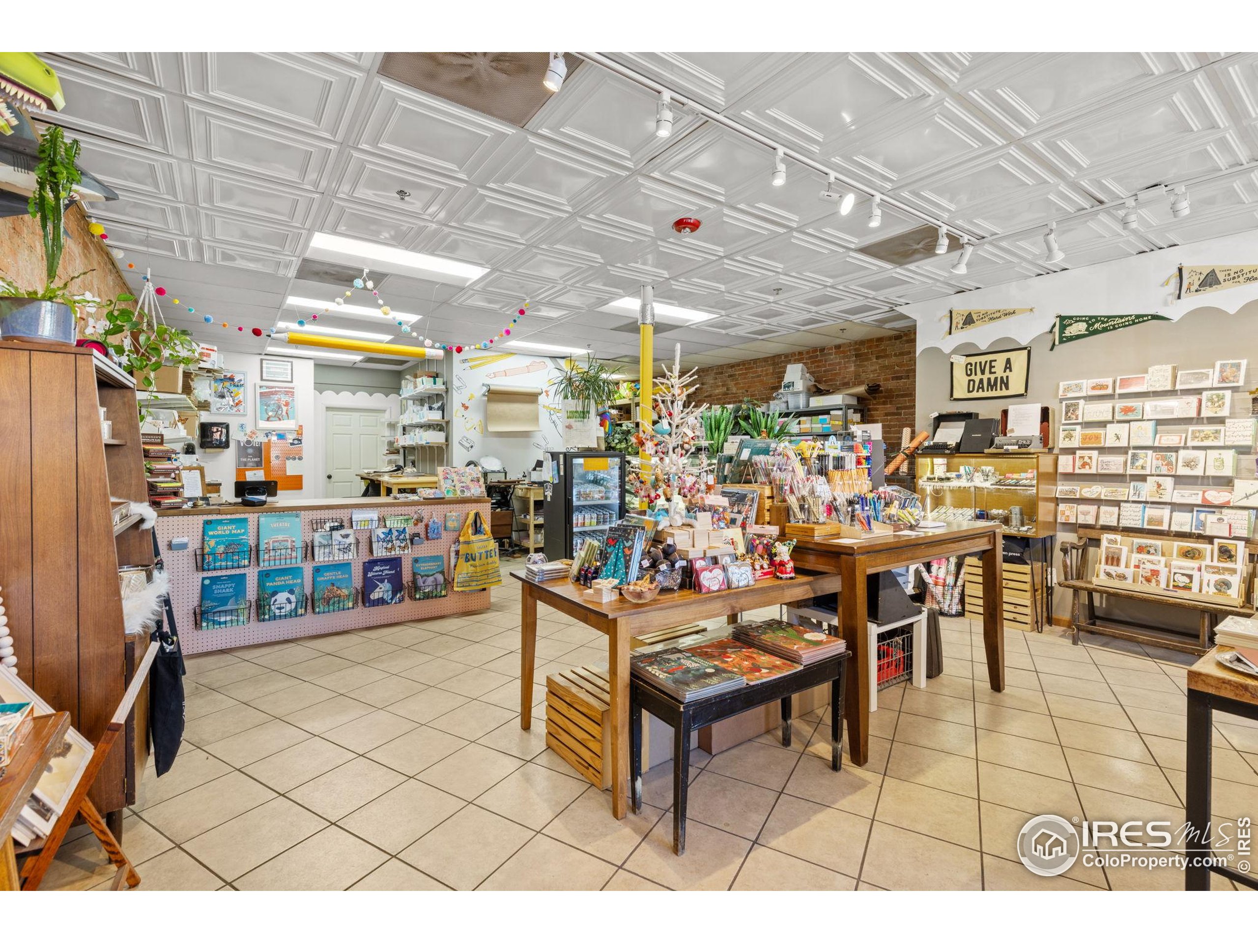 331 Main Street Longmont, CO 80501 - Photo 9 of 50 a living room with lots of furniture and white walls