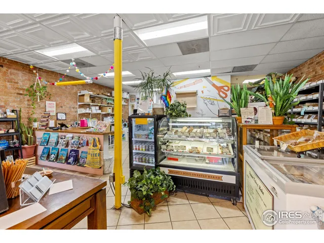 a view of a street with an outdoor seating