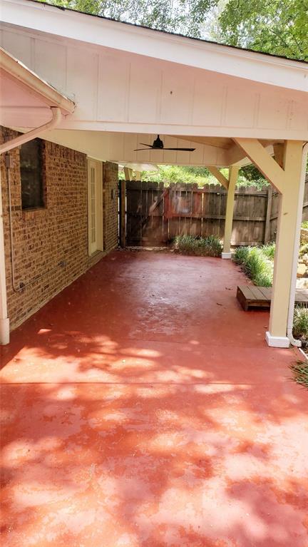 401 South Timberlane Lone Star, TX 75668 - Photo 13 of 27 a view of a big room with wooden floor and a outdoor space