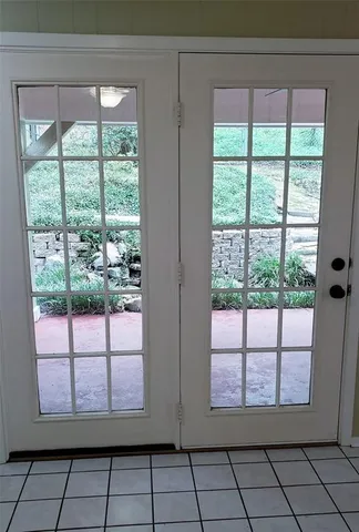 a kitchen with stainless steel appliances kitchen island granite countertop a sink and cabinets