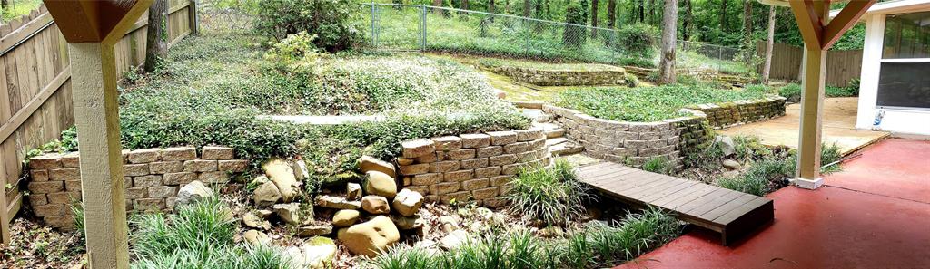 401 South Timberlane Lone Star, TX 75668 - Photo 17 of 27 a view of a yard with plants and a bench