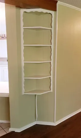 a bathroom with a granite countertop sink a mirror and a shower