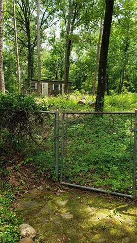 a view of a backyard of the house