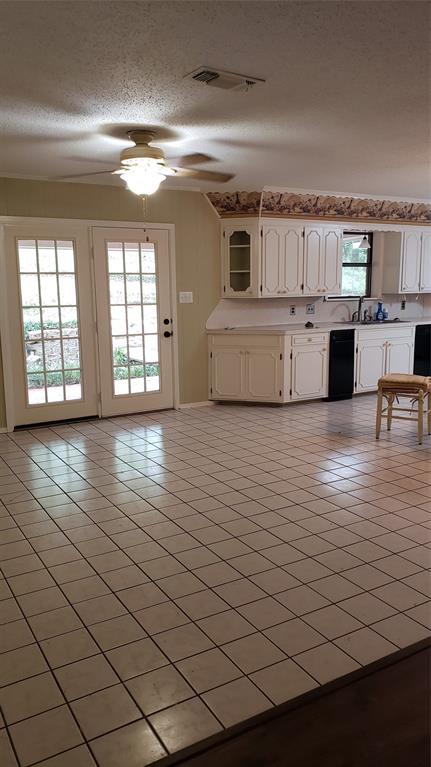 401 South Timberlane Lone Star, TX 75668 - Photo 5 of 27 a view of a kitchen with microwave and cabinets