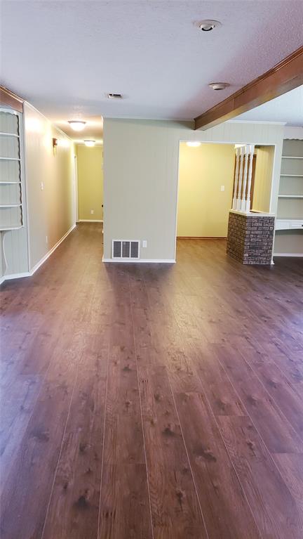 401 South Timberlane Lone Star, TX 75668 - Photo 7 of 27 an empty room with wooden floor and windows