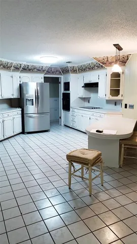 a view of a terrace with chairs