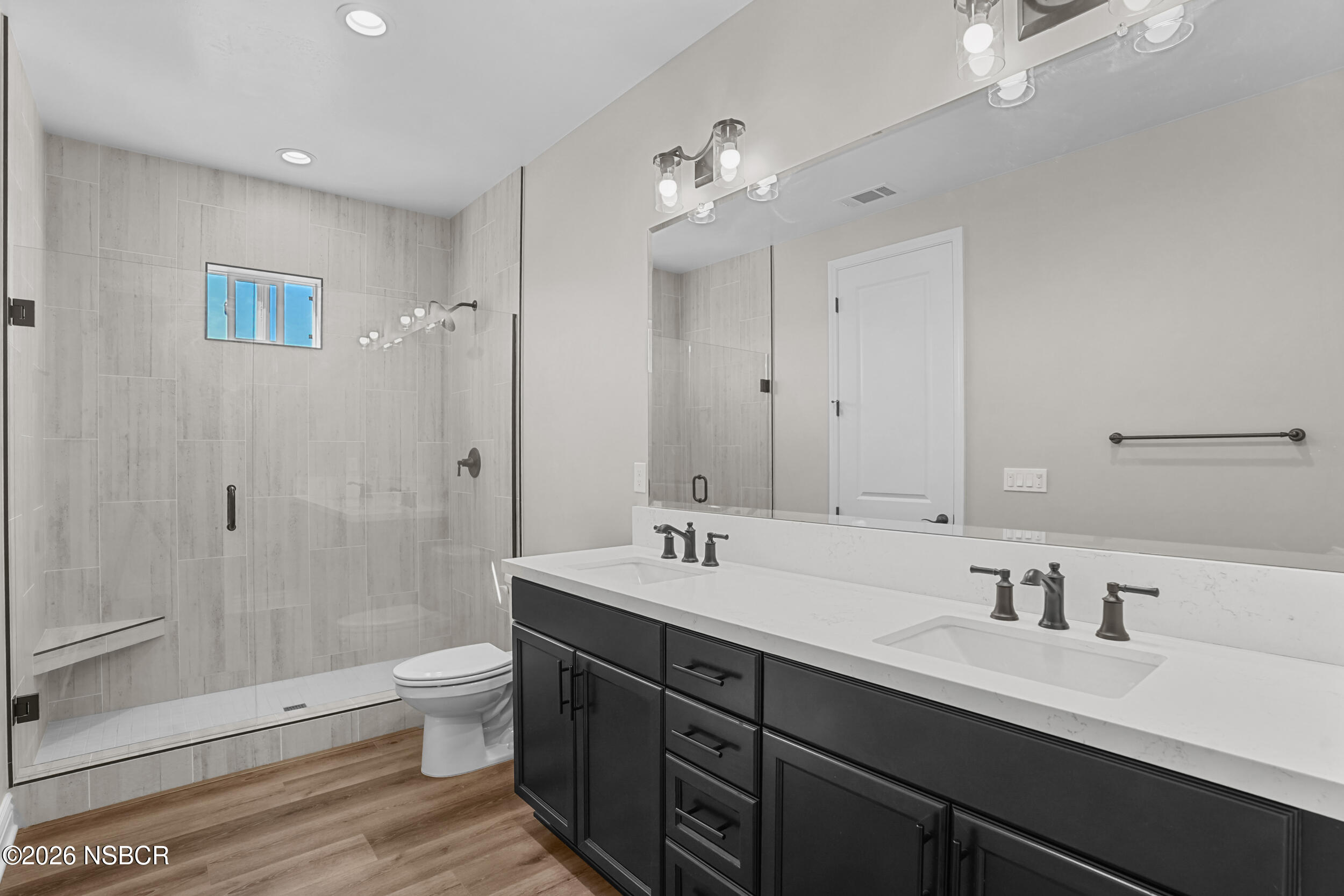 1147 Ginger Place Santa Maria, CA 93455 - Photo 16 of 55 a bathroom with a sink double vanity granite toilet and shower