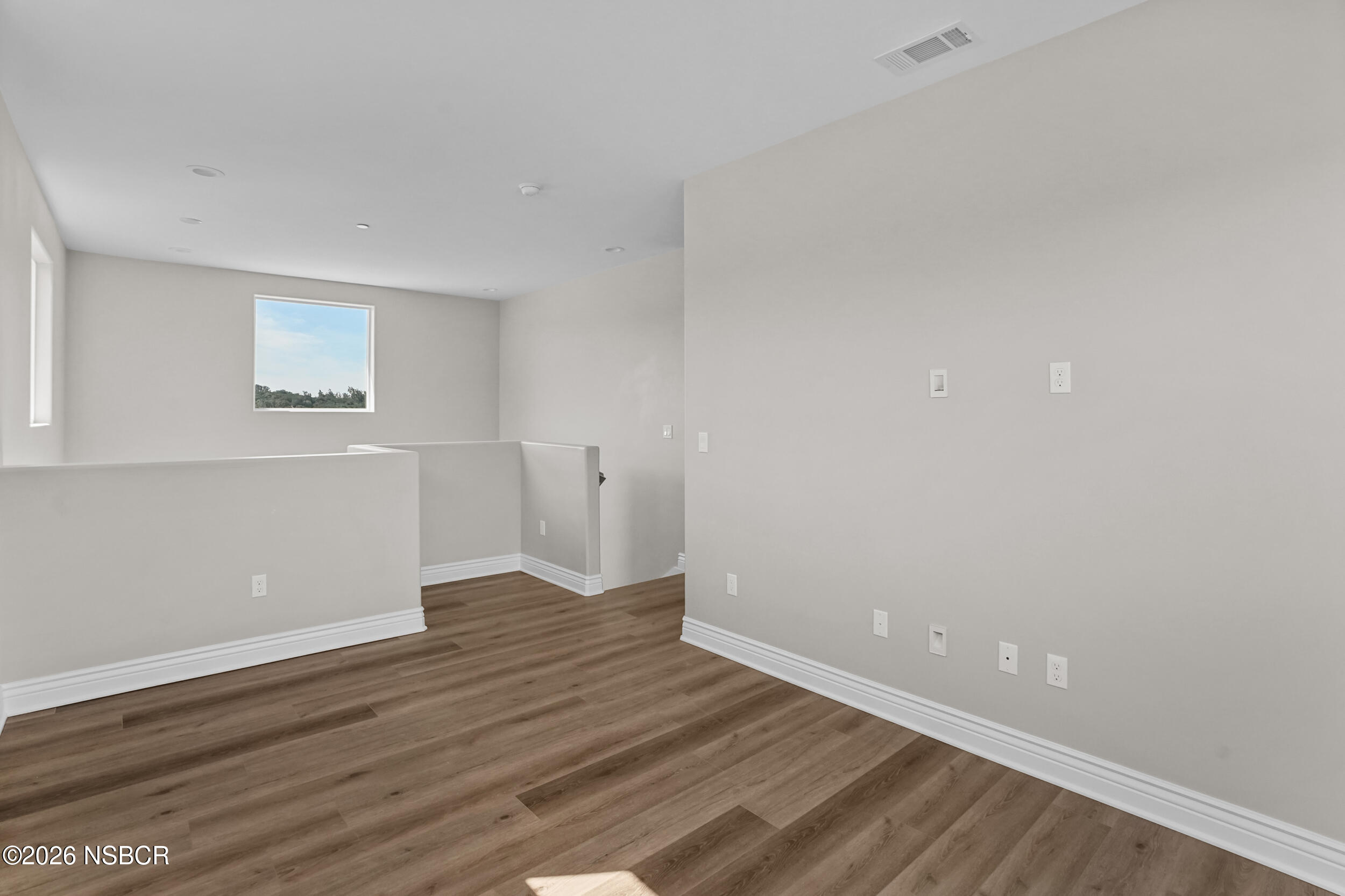 1147 Ginger Place Santa Maria, CA 93455 - Photo 24 of 55 a view of an empty room with wooden floor and a window