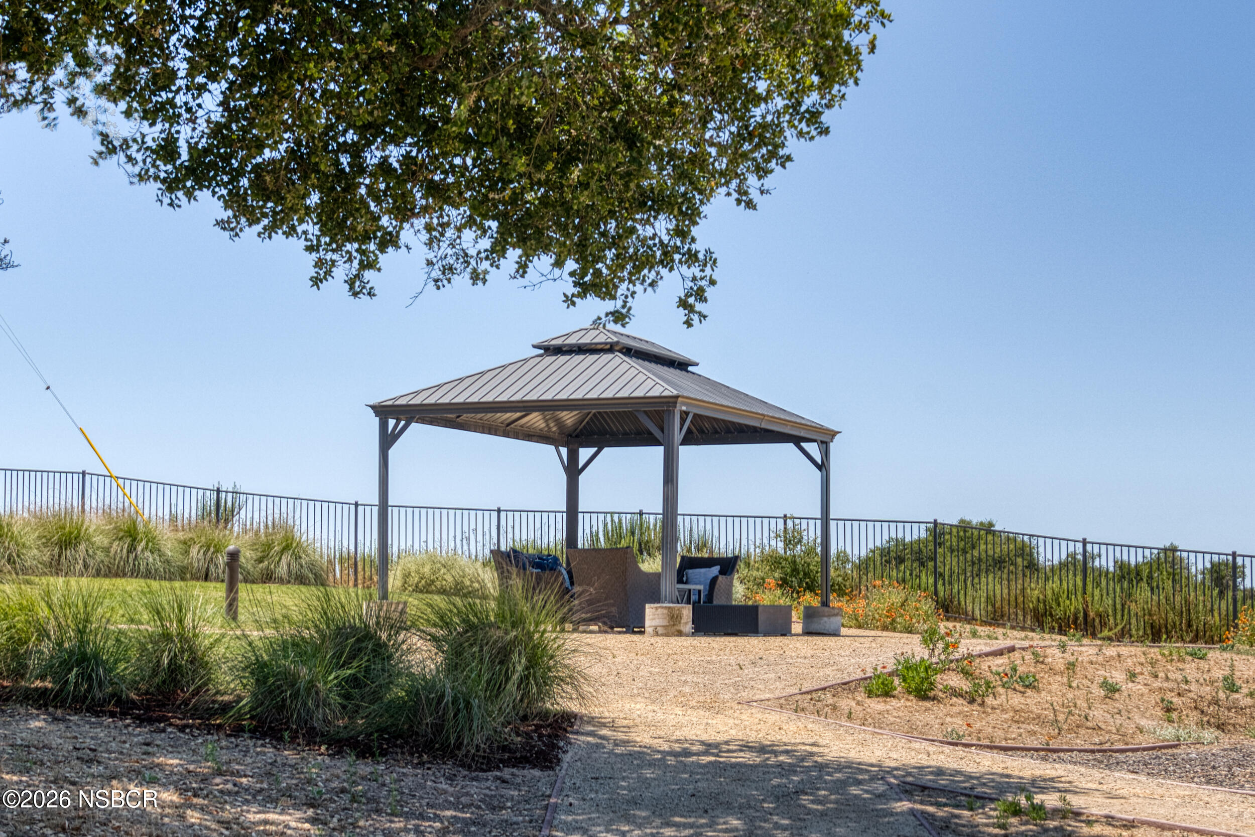 1147 Ginger Place Santa Maria, CA 93455 - Photo 49 of 55 a view of a table and chairs under an umbrella