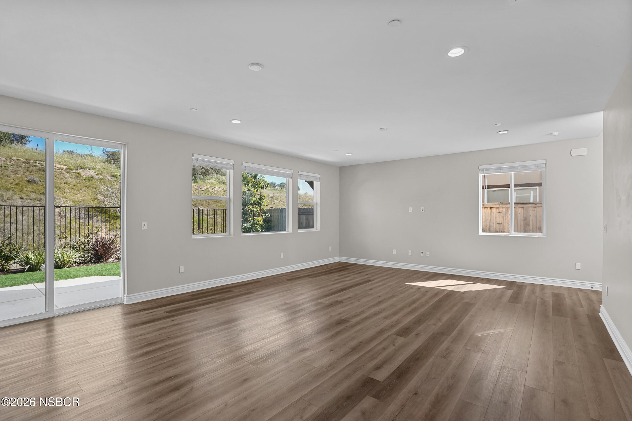 1147 Ginger Place Santa Maria, CA 93455 - Photo 5 of 55 a view of an empty room with wooden floor and a window