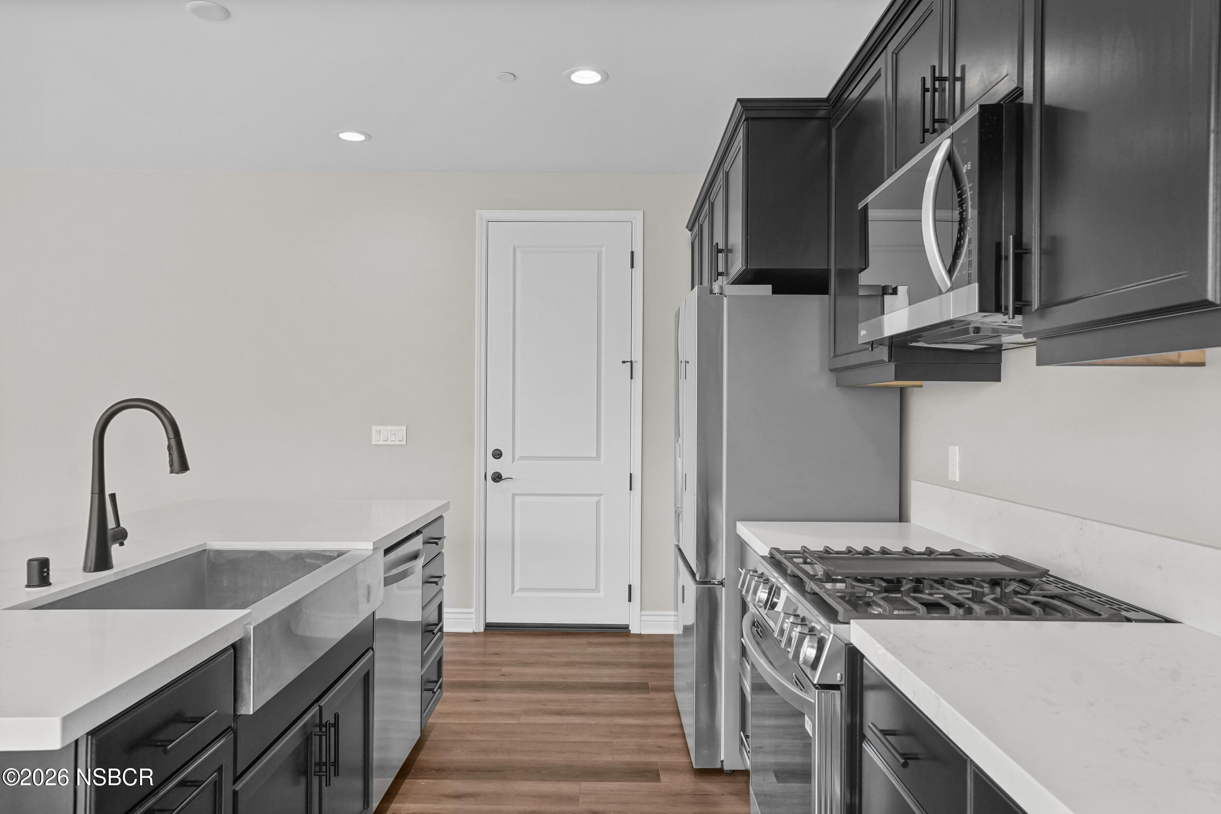 1147 Ginger Place Santa Maria, CA 93455 - Photo 8 of 55 a kitchen with a stove and a sink