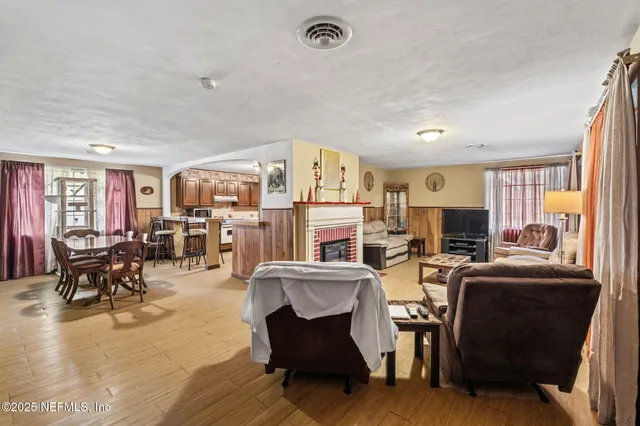 a view of a room with furniture and a window