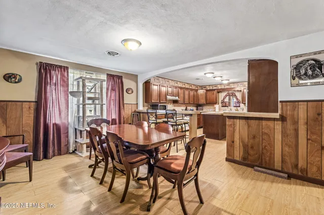 a view of a backyard with large trees