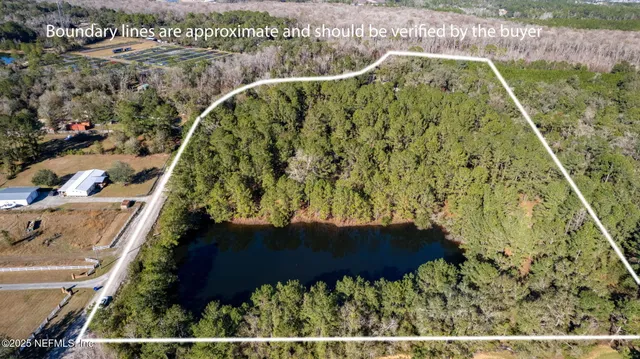 a kitchen with a sink cabinets stainless steel appliances and a window