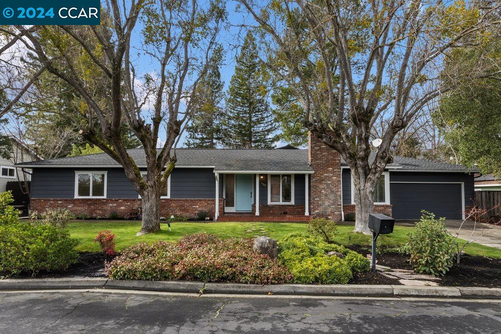 front view of a house with a garden