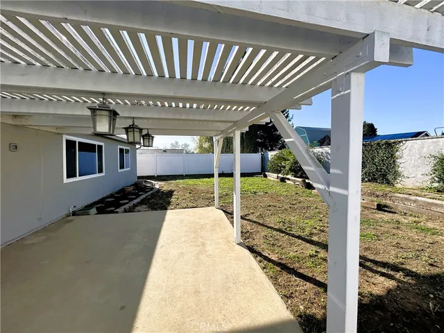 a view of a house with backyard and porch