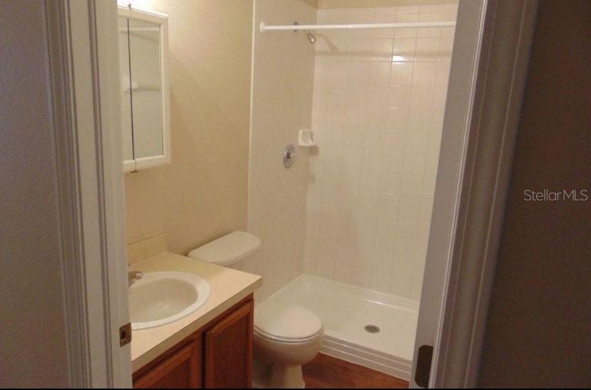 5816 Congress Street, Unit 102 New Port Richey, FL 34653 - Photo 13 of 14 a bathroom with a sink toilet and shower