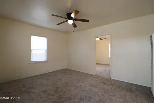 a view of an empty room with a window