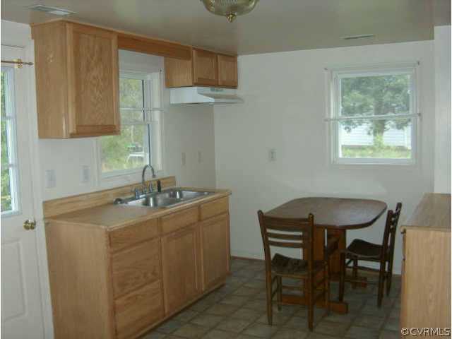 14630 Lodore Road Amelia Court House, VA 23002 - Photo 2 of 3 a room with a sink cabinets and a window