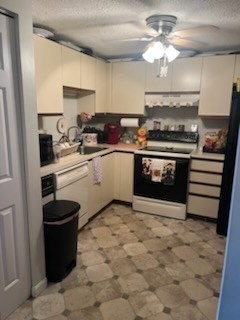 8 9th Street, Unit 513 Medford, MA 02155 - Photo 2 of 10 a kitchen with a stove cabinets and a sink