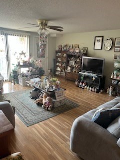 8 9th Street, Unit 513 Medford, MA 02155 - Photo 4 of 10 a living room with lots of furniture and a flat screen tv
