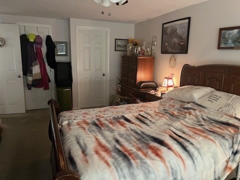 8 9th Street, Unit 513 Medford, MA 02155 - Photo 7 of 10 a bedroom with a bed and a television