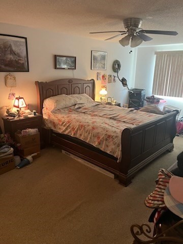 8 9th Street, Unit 513 Medford, MA 02155 - Photo 9 of 10 a bedroom with a bed and wooden floor