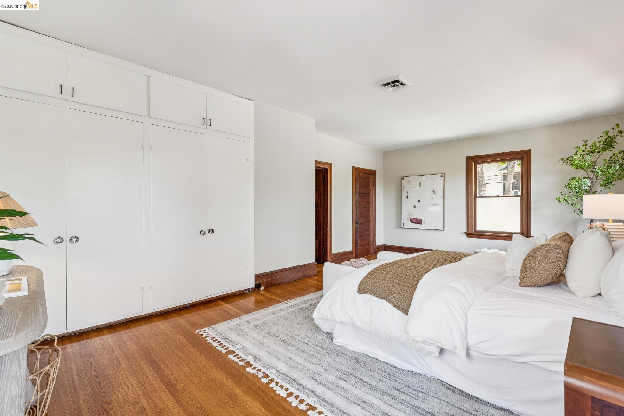 1490 Arch Street Berkeley, CA 94708 - Photo 30 of 57 a bedroom with a large bed and a window