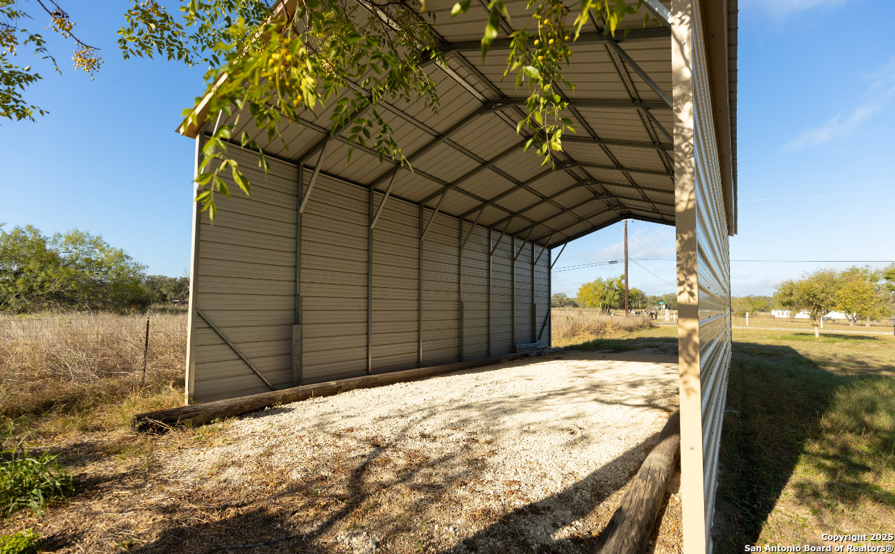 1440 Rendon Road Poteet, TX 78065 - Photo 14 of 22 a view of a backyard of the house