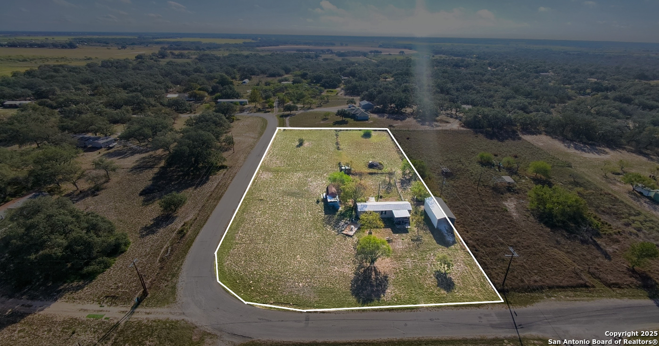 1440 Rendon Road Poteet, TX 78065 - Photo 2 of 22 swimming pool view with a seating space
