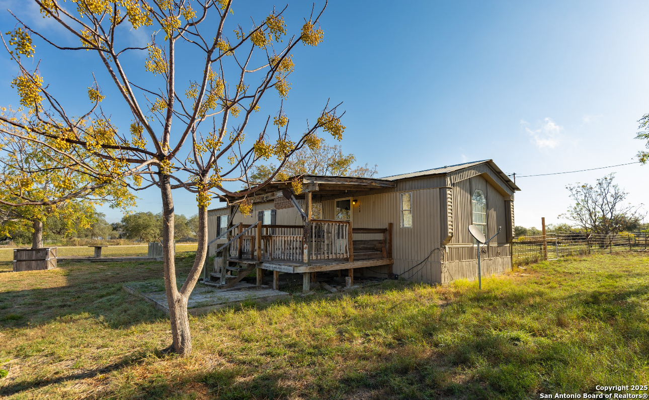 1440 Rendon Road Poteet, TX 78065 - Photo 4 of 22 a view of a house with a yard