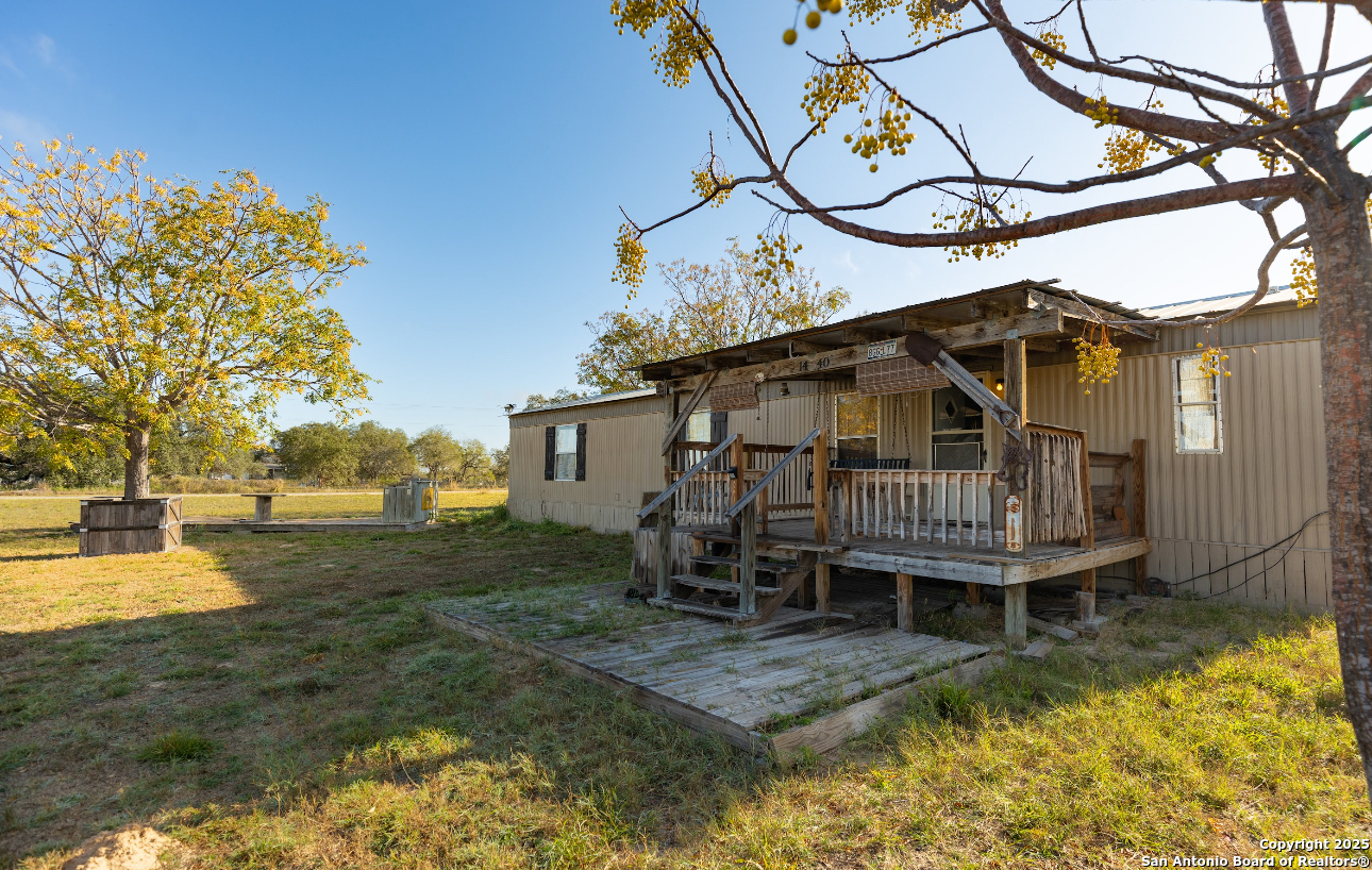 1440 Rendon Road Poteet, TX 78065 - Photo 5 of 22 a view of a house with backyard and sitting area