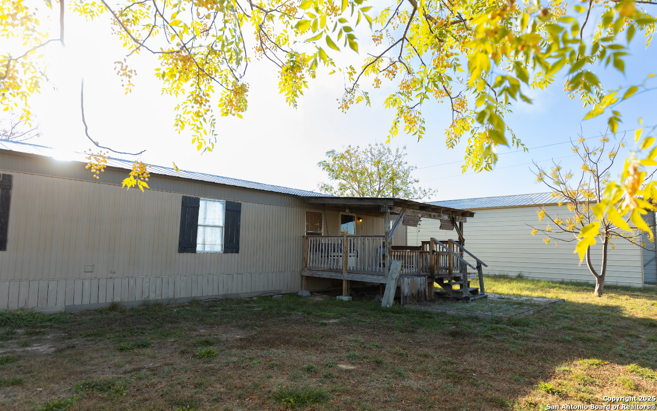 1440 Rendon Road Poteet, TX 78065 - Photo 6 of 22 a view of backyard and wooden fence