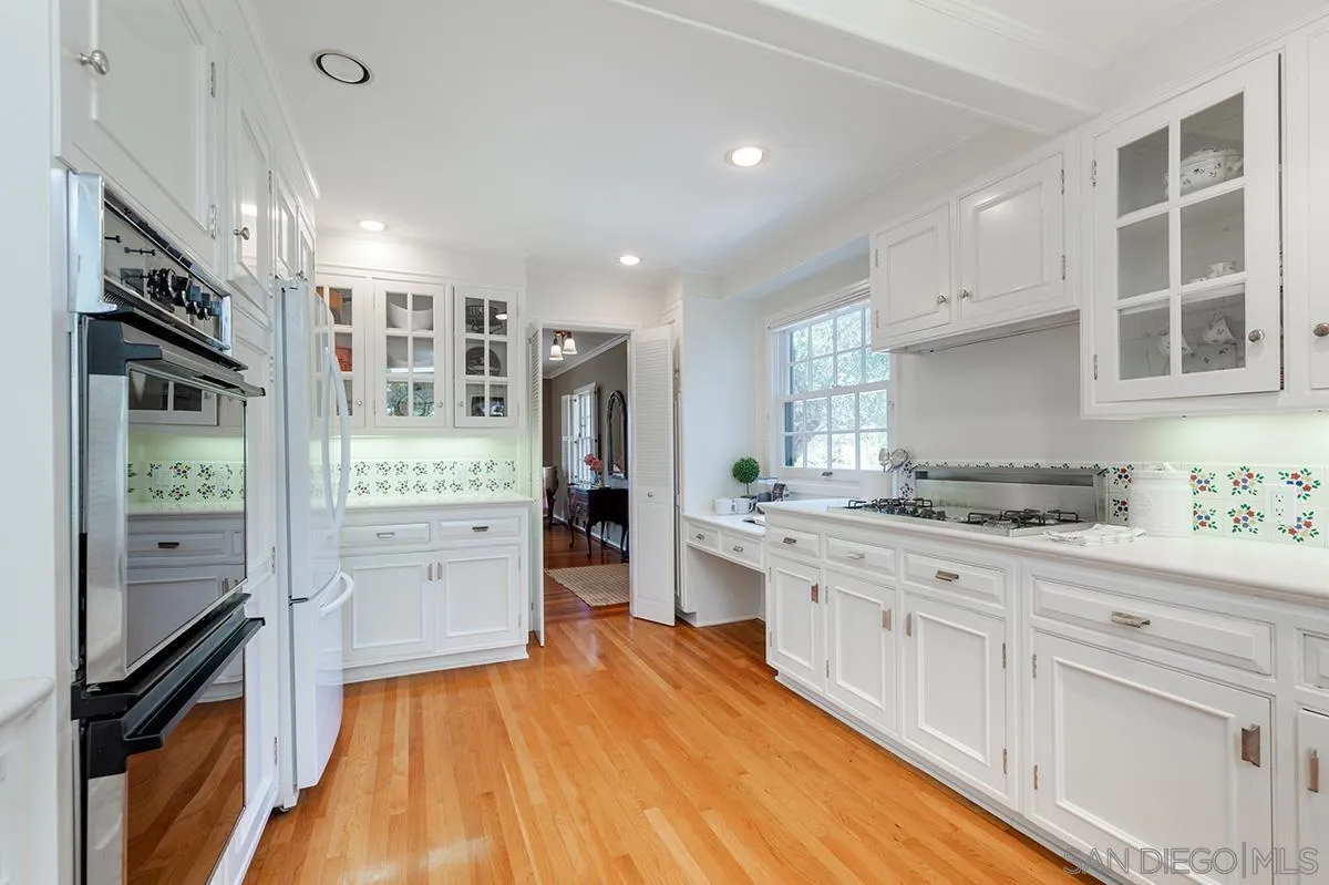 305 West Olive Street San Diego, CA 92103 - Photo 21 of 74 a kitchen with stainless steel appliances granite countertop a stove and a refrigerator