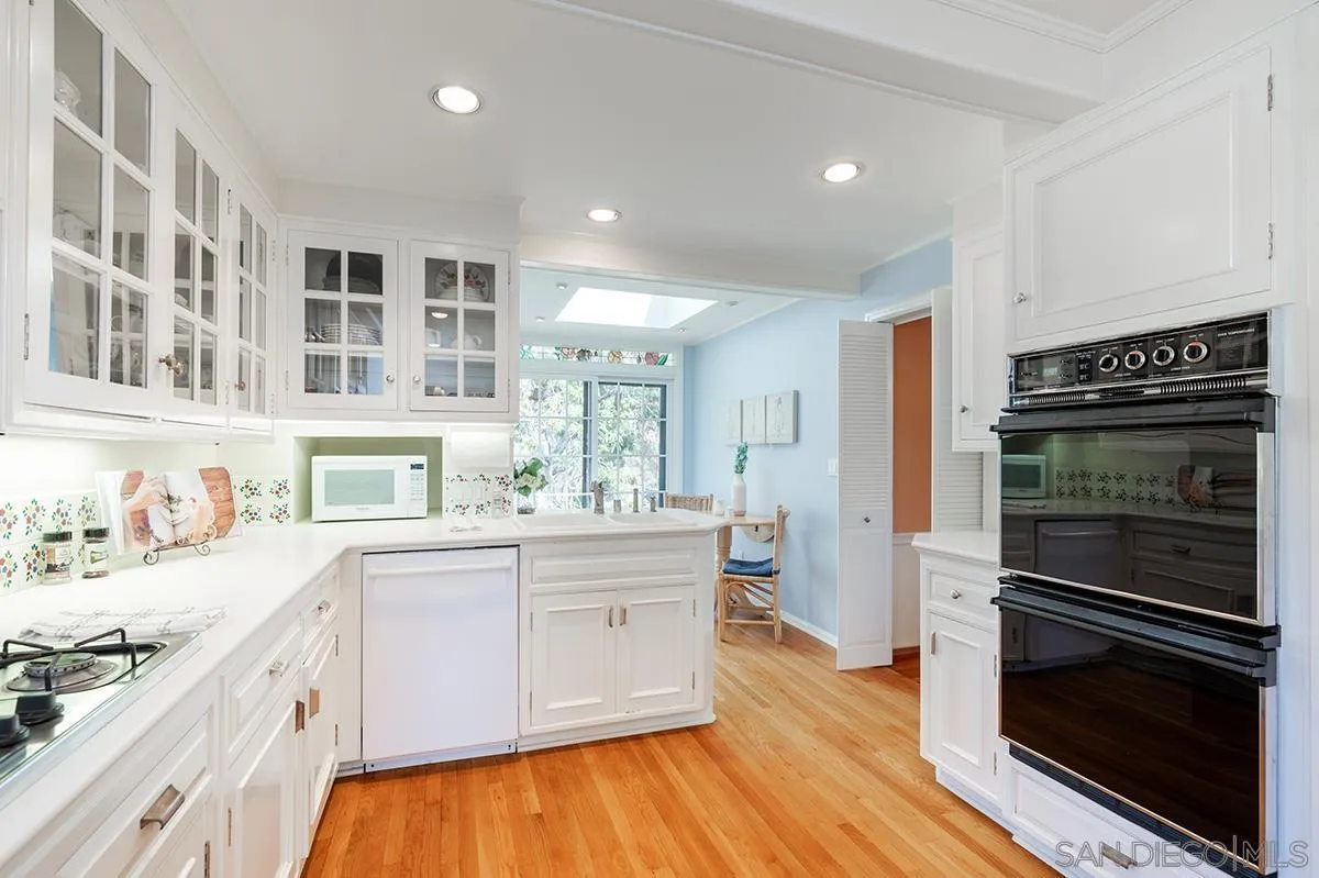 305 West Olive Street San Diego, CA 92103 - Photo 22 of 74 a kitchen with stainless steel appliances a stove a sink and a refrigerator