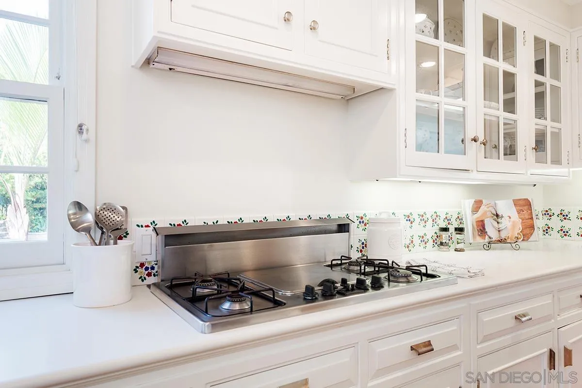 305 West Olive Street San Diego, CA 92103 - Photo 24 of 74 a bathroom with a sink and a stove