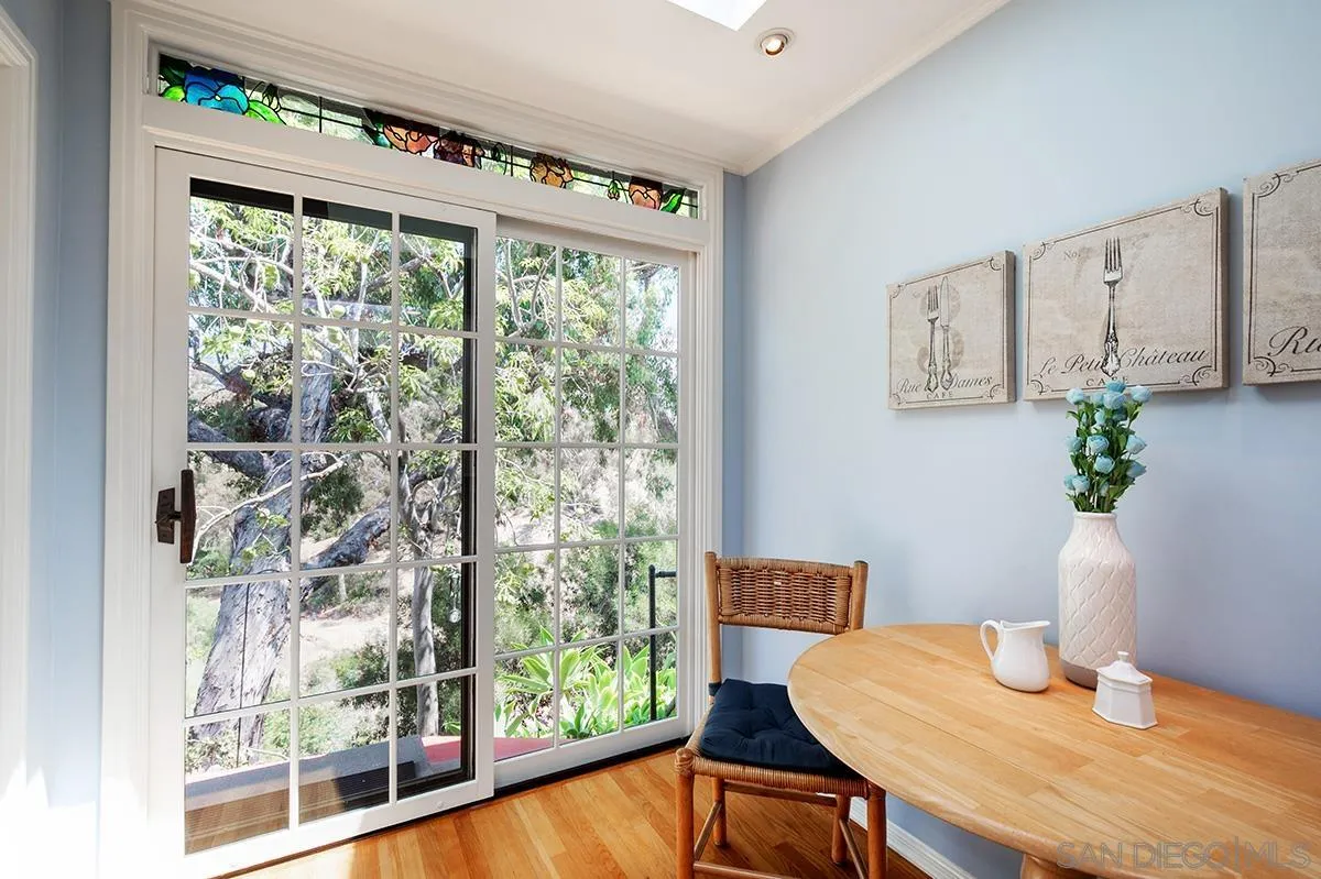 305 West Olive Street San Diego, CA 92103 - Photo 27 of 74 a view of a dining room with furniture window and wooden floor
