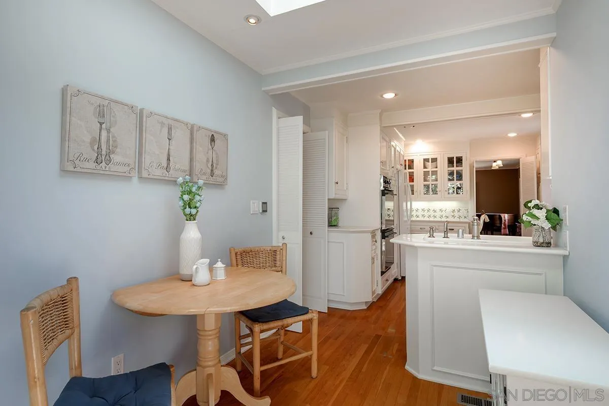305 West Olive Street San Diego, CA 92103 - Photo 28 of 74 a view of a dining room with furniture and wooden floor