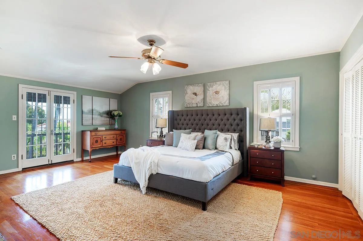 305 West Olive Street San Diego, CA 92103 - Photo 40 of 74 a bedroom with a large bed and wooden floor